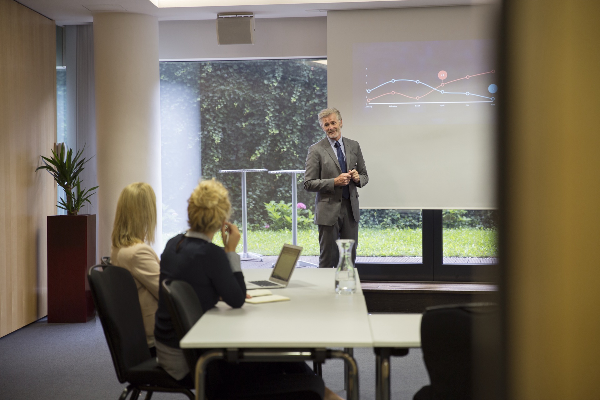 Colleagues collaborating in a conference room presentation